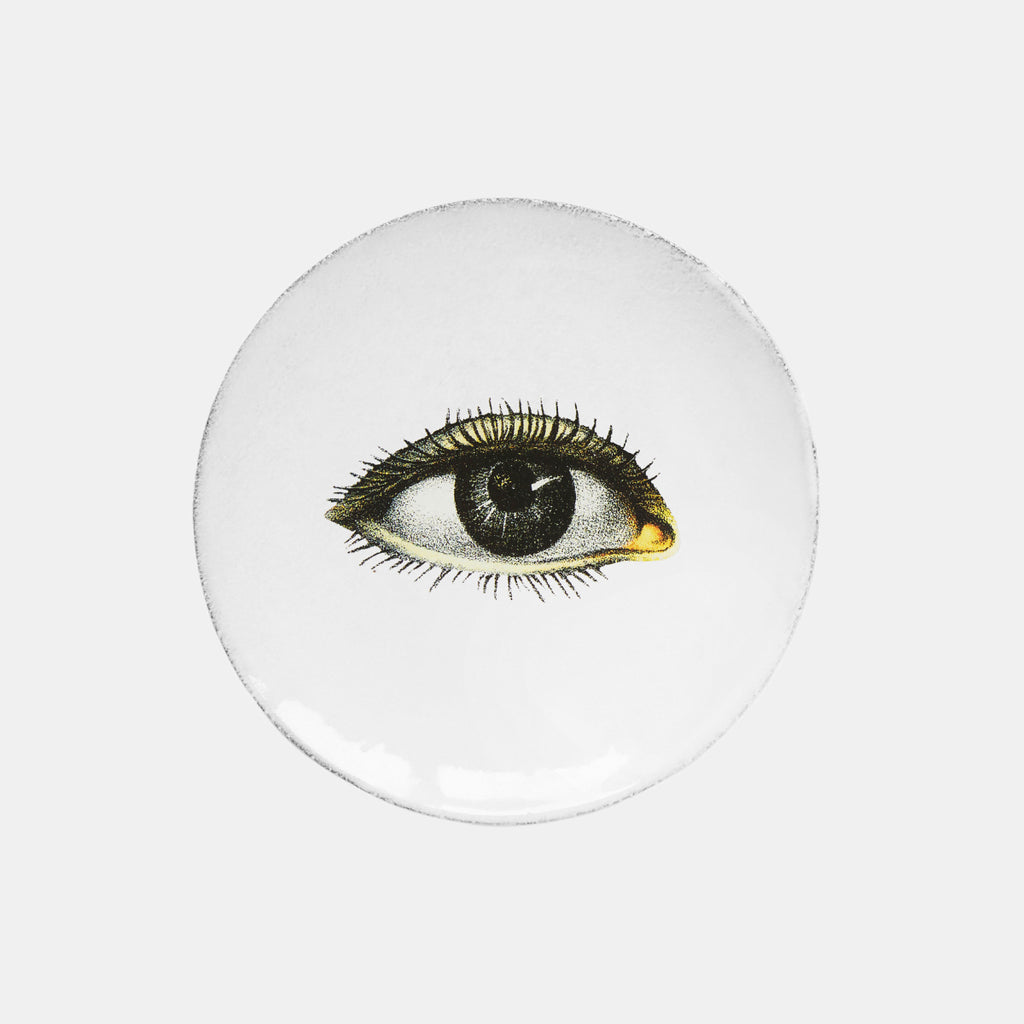 White ceramic plate with single eye by Astier de Villatte and John Derian in Amsterdam Nederlands