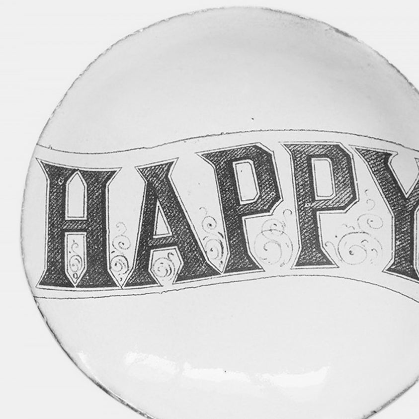 White ceramic plate with happy by John Derian close up