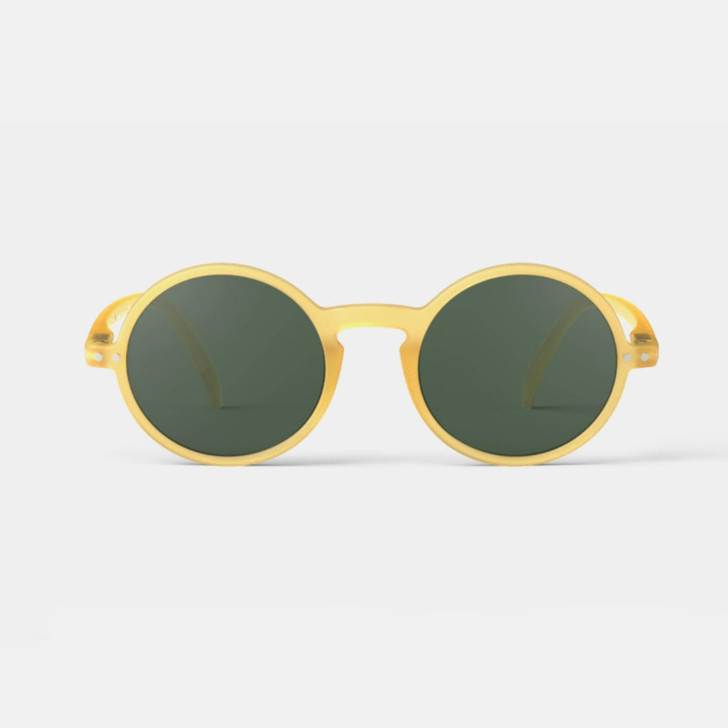 Circle yellow sunglasses with green lenses by Izipizi in Amsterdam Netherlands