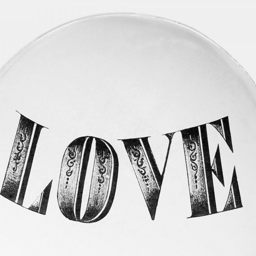 White ceramic plate with love text by john derian close up