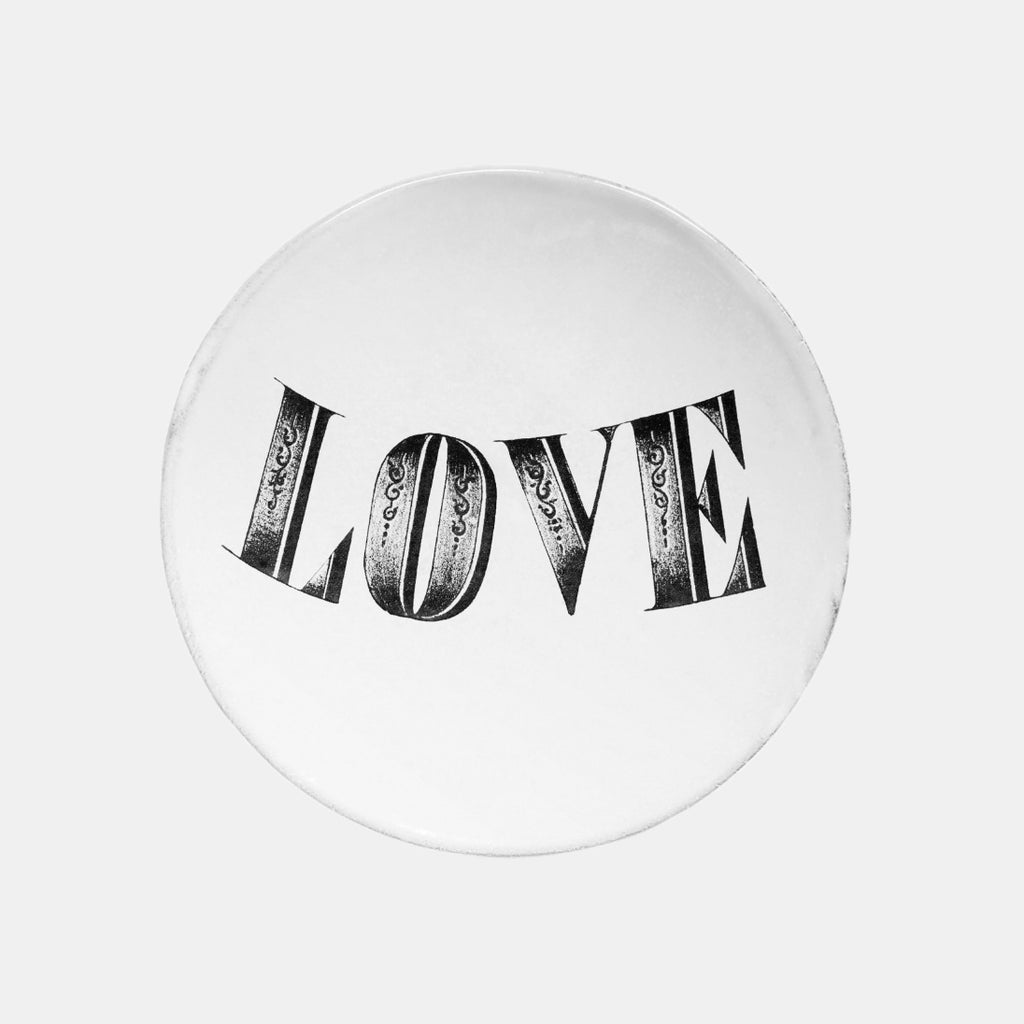 White ceramic plate with love text by john derian