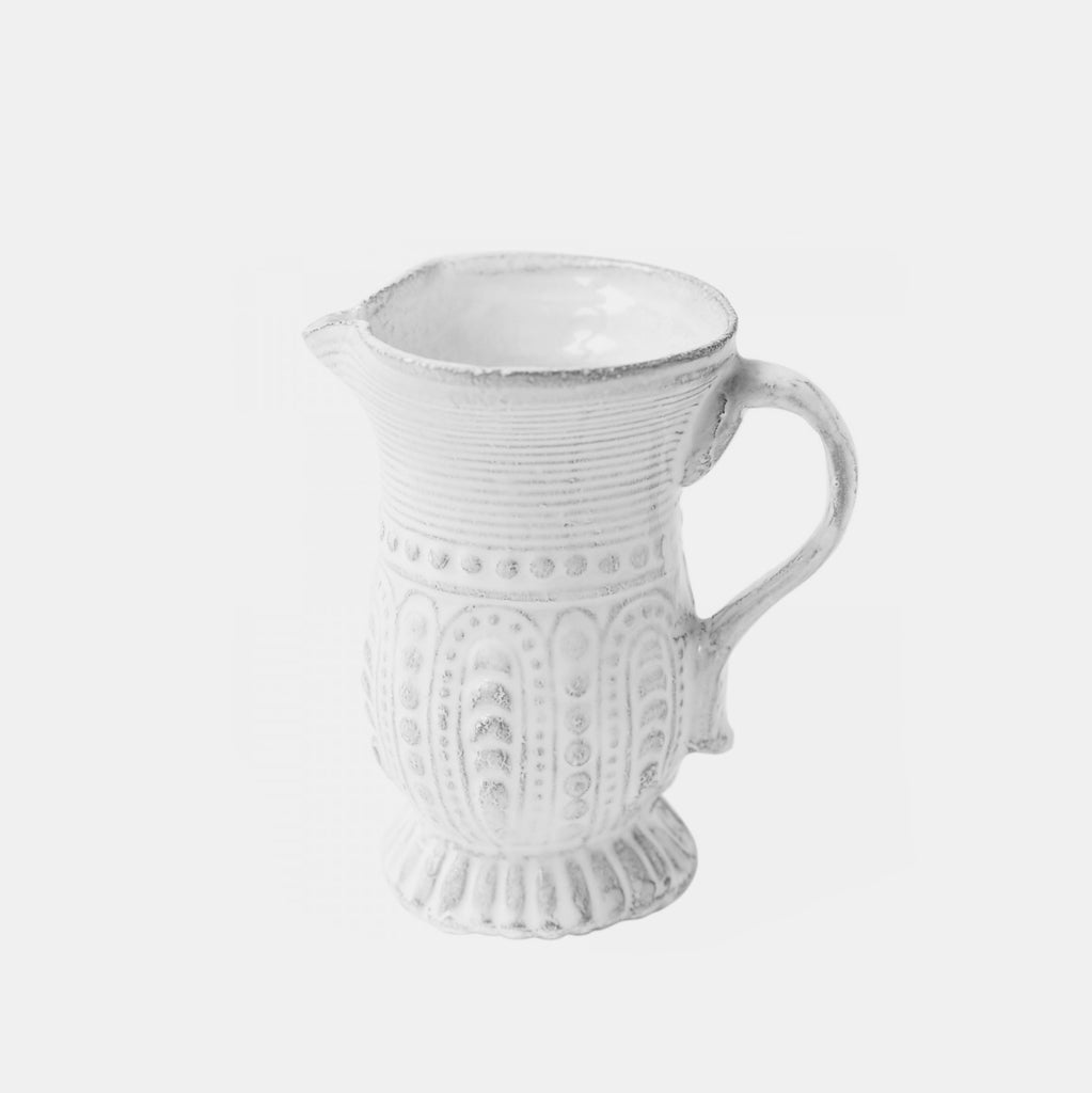 Small white ceramic pitcher and creamer by Astier de Villatte in Amsterdam Nederlands